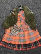 Two Scottish kilts together with a waist coat,