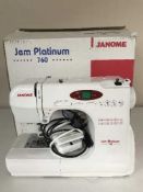 A boxed Janome Gem Platinum 760 sewing machine