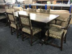An oak refectory table and six upholstered chairs