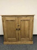 A reclaimed pine double door cupboard