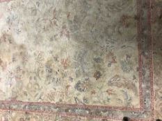 Contemporary floral rug on gold ground