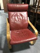 A red leather beech framed armchair