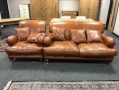 A tan leather two seater settee,