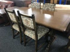 An oak refectory table and four chairs