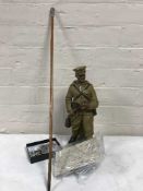 A good collection of militaria - buttons, badges, shell casing caps, swagger stick,