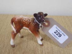 A Beswick figure - Dairy Shorthorn Calf, model 1406C, gloss.