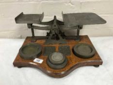 A set of antique postal scales with weights