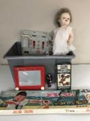 A crate of assorted vintage toys