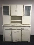 A mid 20th century painted kitchen cabinet