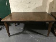 A late Victorian wind out table fitted two leaves