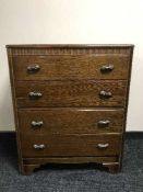 An oak four drawer chest