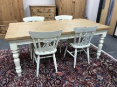A painted pine farmhouse dining table and four chairs