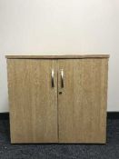 A double door office stationary cupboard,