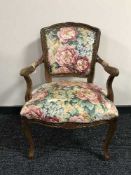 A walnut framed floral armchair