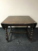 An oak flap sided dining table