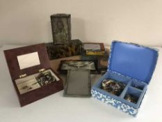 A tray of vintage photo frames and tins, cigarette case,