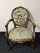 A walnut framed armchair