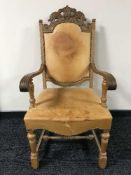 A carved oak armchair