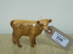 A Beswick figure - Highland Calf, model 1827D, gloss.