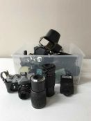 A box containing assorted cameras,