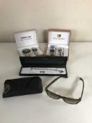 A tray containing a pair of Rayban sunglasses in case, silver bracelet,