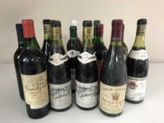 A crate containing fourteen assorted bottles of wine including four bottles of Pierre Ponnelle