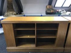An early 20th century oak double sided library bookcase