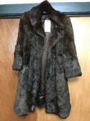 A vintage lady's musquash fur coat
