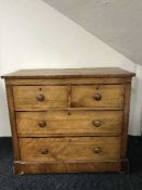 A Victorian satinwood four drawer chest
