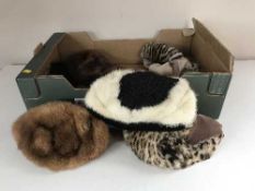 A box of nine assorted vintage fur hats