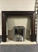 A chrome gas fire insert with marble hearth and back together with a mahogany fire surround