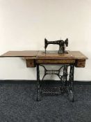 A SInger treadle machine in oak table
