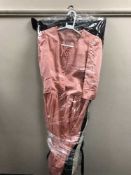 A full rail of lady's dresses,