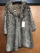 A vintage lady's ocelot fur coat retailed by Harrods of London