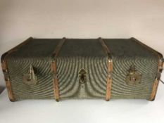 A wooden bound trunk, suitcase,