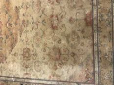 A contemporary carpet on gold ground