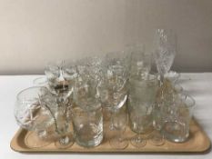 A large quantity of assorted drinking glasses, vinegar bottle,