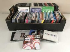 Six boxes containing assorted DVD's and CD's