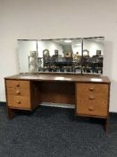 A teak dressing table and mirror