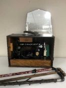 A cased Singer sewing machine,