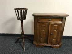 A contemporary side cabinet and a mahogany torchere