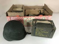 A box of military helmet and crate, small quantity of Meccano,