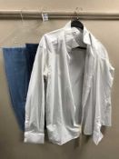 A part rail of lady's clothing, gent's trousers, shirts,