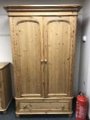 A Victorian style double door wardrobe fitted a drawer