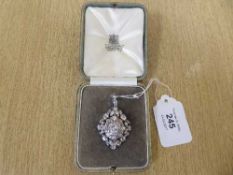 A superb quality diamond pendant/brooch in original Carrington's box,