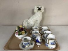 A tray of flower posy, dog,