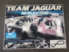 A Team Jaguar Scalextric set,
