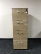 Four drawer wood effect filing cabinet with key