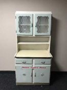 A mid 20th century double door kitchen cabinet