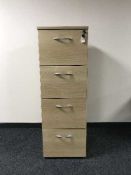 Four drawer wood effect filing cabinet with key